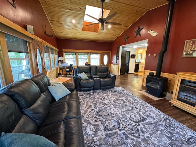 4220 23rd St NW, Willmar, MN 56201 - living room with wood ceiling, wood finished floors, ceiling fan, a wood stove, and vaulted ceiling