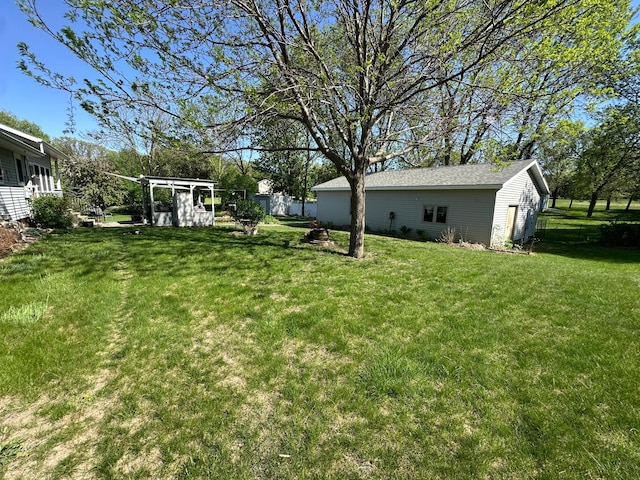 4220 23rd St NW, Willmar, MN 56201 - view of green lawn with an outdoor structure