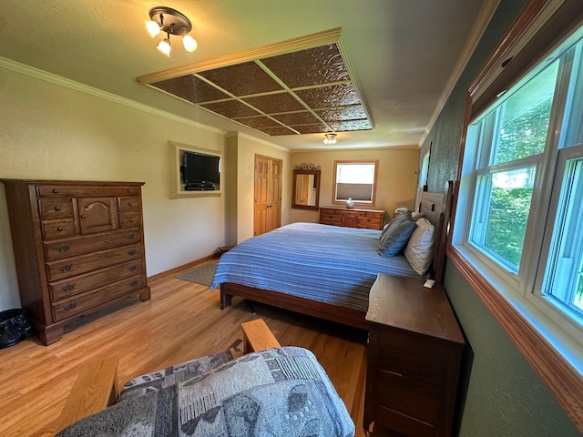 4220 23rd St NW, Willmar, MN 56201 - bedroom with wood finished floors, ornamental molding, and baseboards