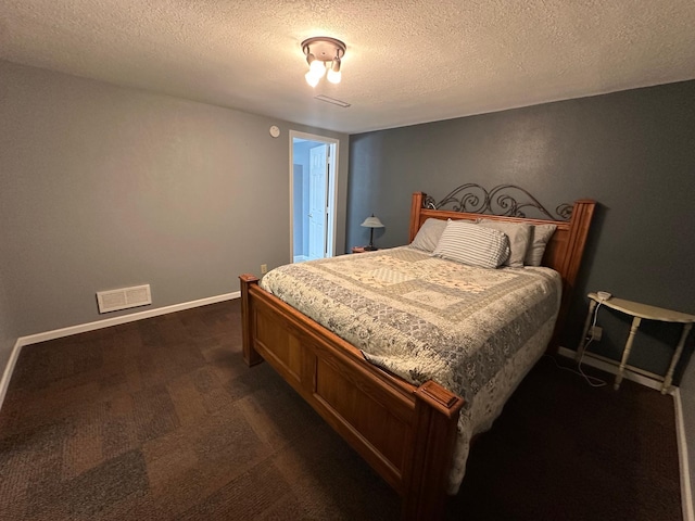 4220 23rd St NW, Willmar, MN 56201 - bedroom with dark colored carpet, a textured ceiling, and baseboards