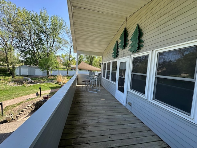 4220 23rd St NW, Willmar, MN 56201 - wooden deck featuring a yard