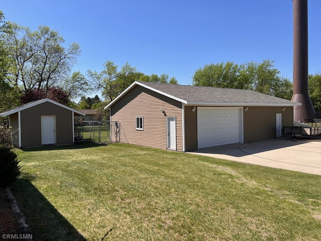 404 Clayborn Ave, Parkers Prairie, MN 56361 - view of property exterior with an outbuilding, a detached garage, and driveway