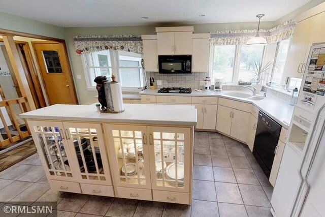 404 Clayborn Ave, Parkers Prairie, MN 56361 - kitchen with black appliances, plenty of natural light, a sink, light countertops, and recessed lighting