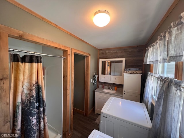 404 Clayborn Ave, Parkers Prairie, MN 56361 - clothes washing area with washer / clothes dryer, dark wood finished floors, and cabinet space