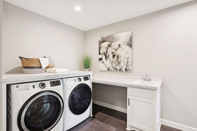4789 131st Ct NE, Blaine, MN 55449 - washroom featuring washer and clothes dryer, a sink, baseboards, dark tile patterned floors, and recessed lighting