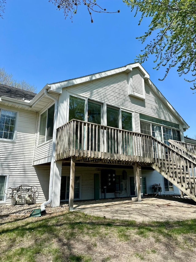 rear view of property with a deck