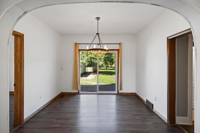 5844 Stagecoach Trl N, Oak Park Heights, MN 55082 - unfurnished dining area with dark wood-style flooring, a chandelier, and arched walkways