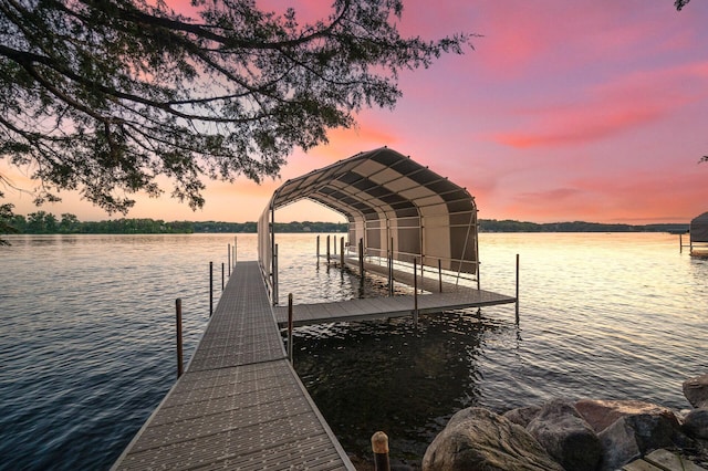 dock area with a water view