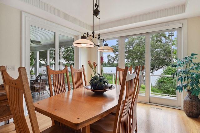 dining area featuring light wood-type flooring