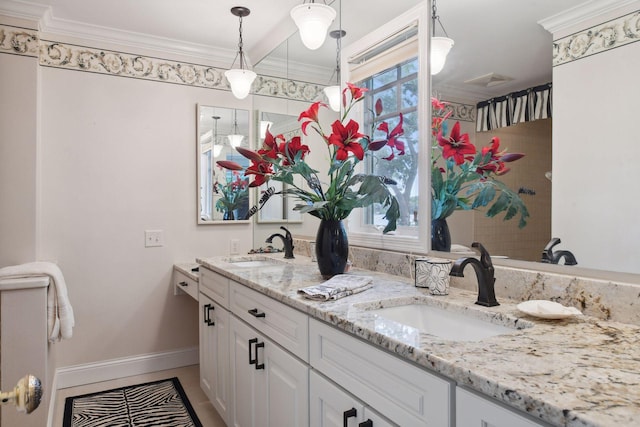 full bathroom featuring baseboards, double vanity, plenty of natural light, and ornamental molding