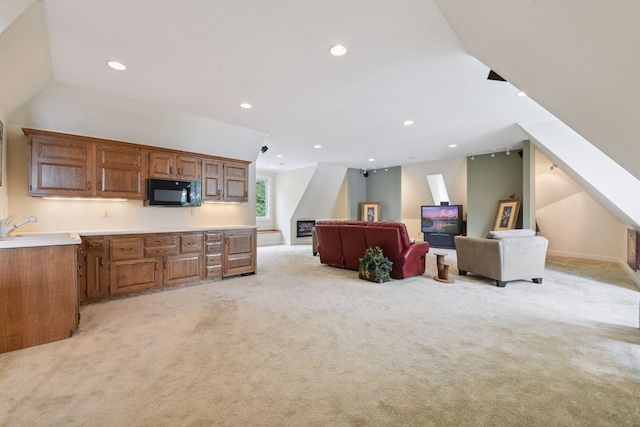 interior space featuring light colored carpet, recessed lighting, and stairs