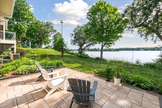 view of patio / terrace featuring a water view and central AC