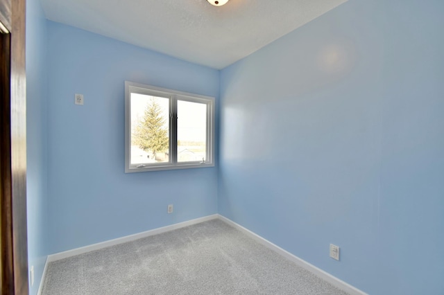 419 5th St NE, Staples, MN 56479 - carpeted empty room with baseboards