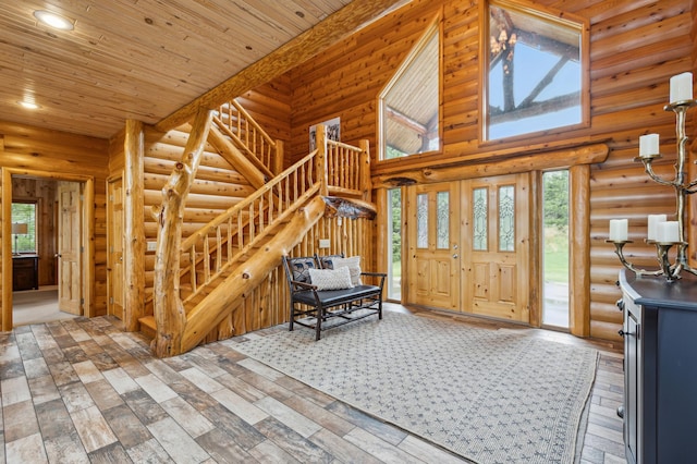 5784 Mcgowan Rd, Brainerd, MN 56401 - entrance foyer featuring stairs, log walls, wood finished floors, a towering ceiling, and wood ceiling