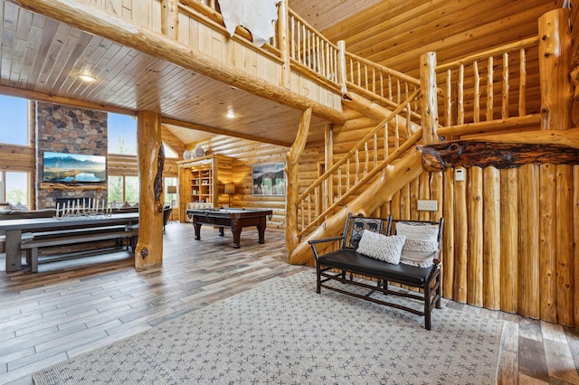 5784 Mcgowan Rd, Brainerd, MN 56401 - living room with pool table, rustic walls, hardwood / wood-style floors, wood ceiling, and high vaulted ceiling