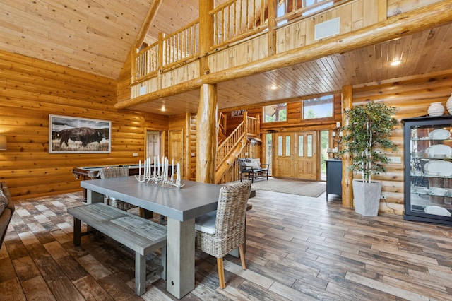 5784 Mcgowan Rd, Brainerd, MN 56401 - dining space featuring stairway, wood ceiling, high vaulted ceiling, wood-type flooring, and log walls