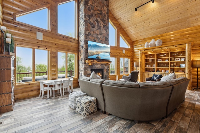 5784 Mcgowan Rd, Brainerd, MN 56401 - living area featuring high vaulted ceiling, a stone fireplace, hardwood / wood-style floors, and wood ceiling