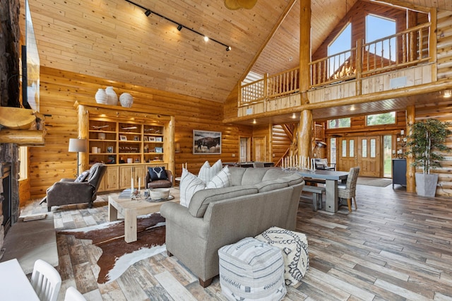 5784 Mcgowan Rd, Brainerd, MN 56401 - living room with rail lighting, high vaulted ceiling, stairs, wooden ceiling, and wood-type flooring