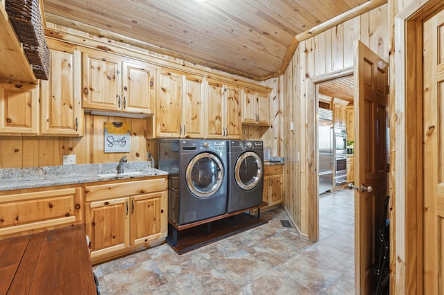 5784 Mcgowan Rd, Brainerd, MN 56401 - washroom featuring cabinet space, washing machine and clothes dryer, wood walls, and wood ceiling
