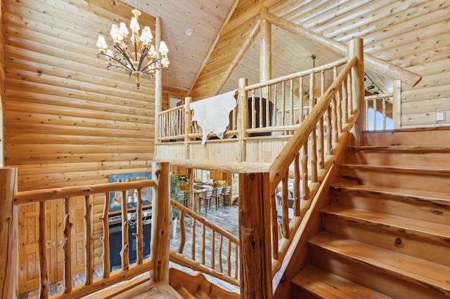 5784 Mcgowan Rd, Brainerd, MN 56401 - staircase with log walls, high vaulted ceiling, wooden ceiling, and a chandelier