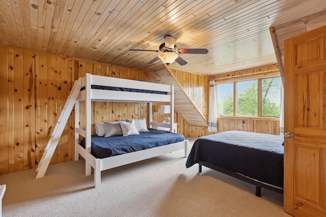 5784 Mcgowan Rd, Brainerd, MN 56401 - bedroom featuring wood ceiling, wood walls, carpet, and ceiling fan