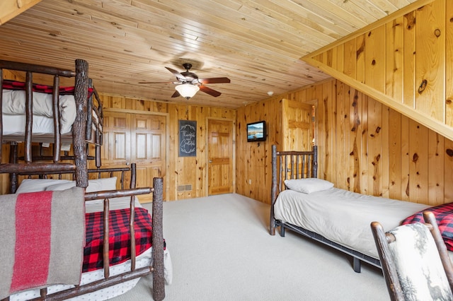 5784 Mcgowan Rd, Brainerd, MN 56401 - carpeted bedroom with wood walls and wood ceiling