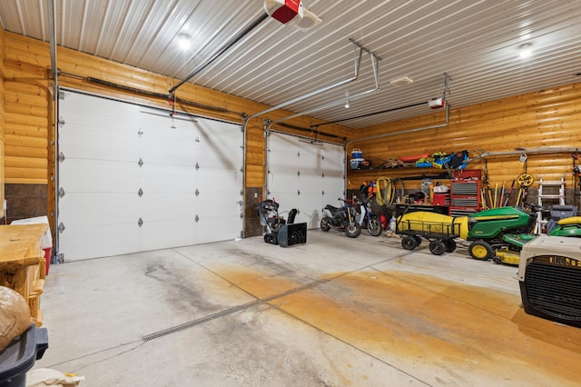 5784 Mcgowan Rd, Brainerd, MN 56401 - garage featuring a garage door opener