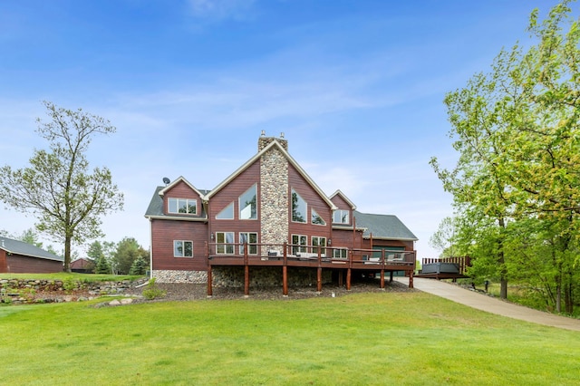 5784 Mcgowan Rd, Brainerd, MN 56401 - rear view of house with a yard, a wooden deck, and a chimney