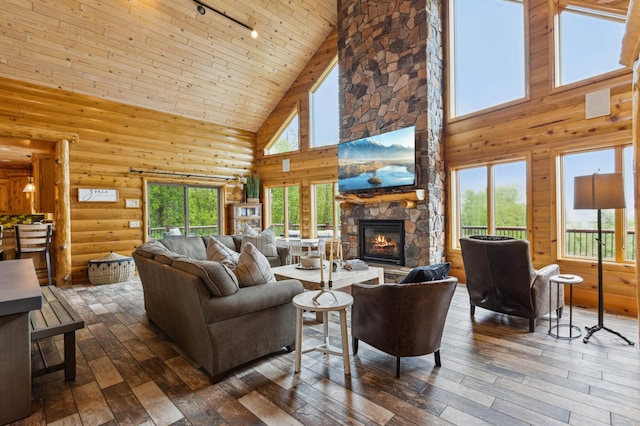 5784 Mcgowan Rd, Brainerd, MN 56401 - living room featuring high vaulted ceiling, track lighting, dark wood-style floors, wooden ceiling, and a fireplace