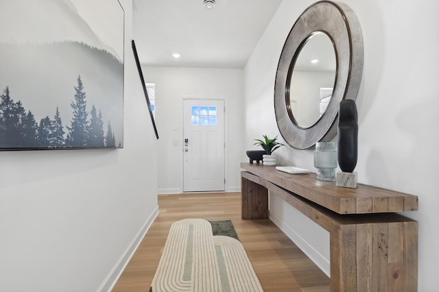 3900 Helmo Ave N, Oakdale, MN 55128 - entryway featuring baseboards, wood finished floors, and recessed lighting
