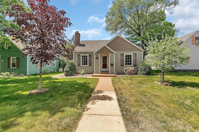 1317 8th Ave N, Saint Cloud, MN 56303 - view of front of house with a chimney, a front lawn, and roof with shingles