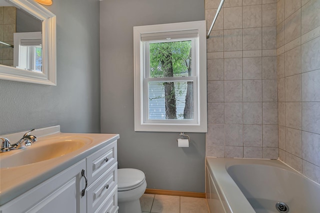 1317 8th Ave N, Saint Cloud, MN 56303 - full bath featuring tile patterned floors, toilet, vanity, baseboards, and shower / tub combination