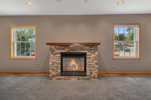 1317 8th Ave N, Saint Cloud, MN 56303 - detailed view of carpet floors, baseboards, a stone fireplace, and recessed lighting