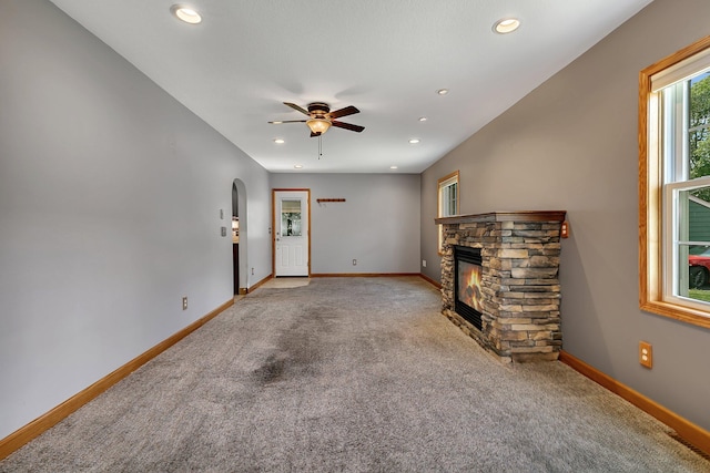 1317 8th Ave N, Saint Cloud, MN 56303 - unfurnished living room with light colored carpet, ceiling fan, a fireplace, baseboards, and recessed lighting