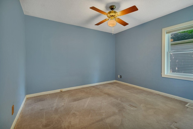 1317 8th Ave N, Saint Cloud, MN 56303 - unfurnished room featuring carpet floors, a ceiling fan, and baseboards