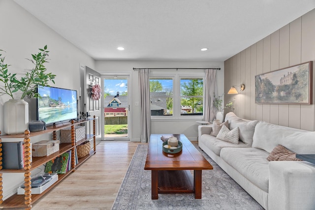 816 5th St S, Stillwater, MN 55082 - living room with light wood finished floors, recessed lighting, and wooden walls