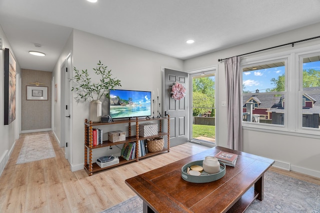 816 5th St S, Stillwater, MN 55082 - living area featuring light wood finished floors, baseboards, and recessed lighting