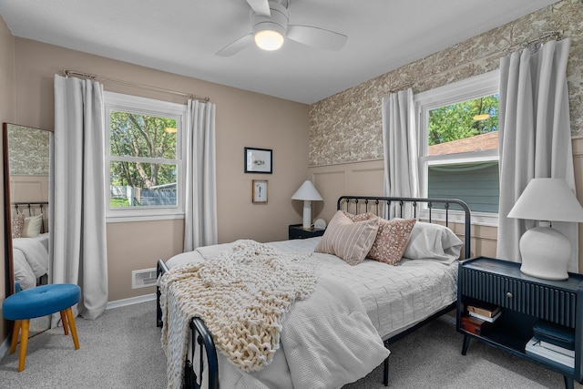 816 5th St S, Stillwater, MN 55082 - carpeted bedroom with multiple windows, a wainscoted wall, ceiling fan, and baseboards