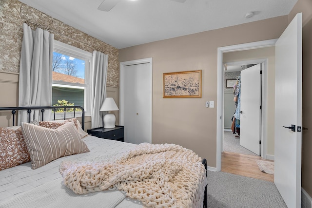 816 5th St S, Stillwater, MN 55082 - bedroom featuring carpet, a closet, baseboards, a ceiling fan, and wallpapered walls
