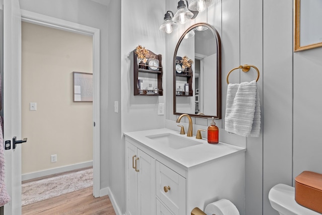 816 5th St S, Stillwater, MN 55082 - bathroom featuring wood finished floors, vanity, and toilet