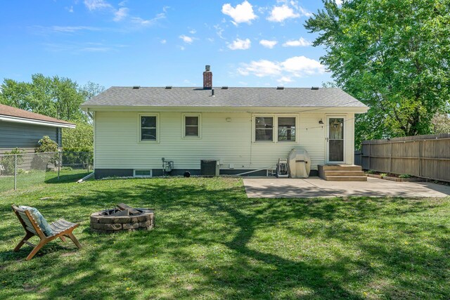 816 5th St S, Stillwater, MN 55082 - back of house featuring an outdoor fire pit, a patio, a chimney, and central AC unit