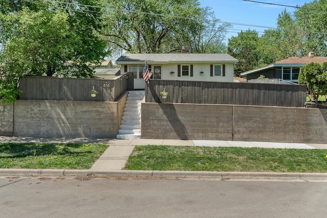 816 5th St S, Stillwater, MN 55082 - bungalow-style home featuring stairway, fence, and a chimney