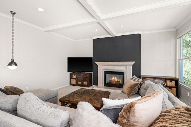 carpeted living area with beamed ceiling, a glass covered fireplace, ornamental molding, coffered ceiling, and baseboards
