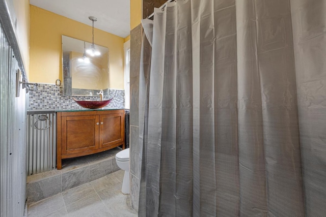 bathroom with vanity, toilet, and a shower with curtain