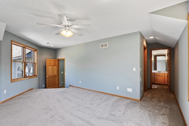 spare room featuring ceiling fan, a textured ceiling, baseboards, carpet, and recessed lighting