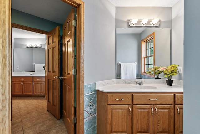 bathroom featuring vanity and tile patterned flooring