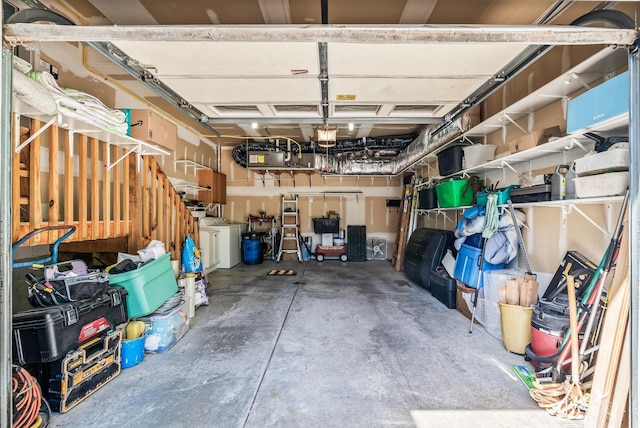 storage area with a garage and separate washer and dryer
