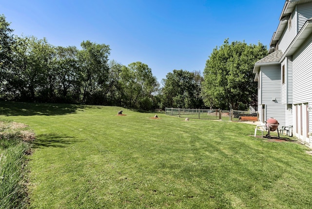 view of yard with view of wooded area