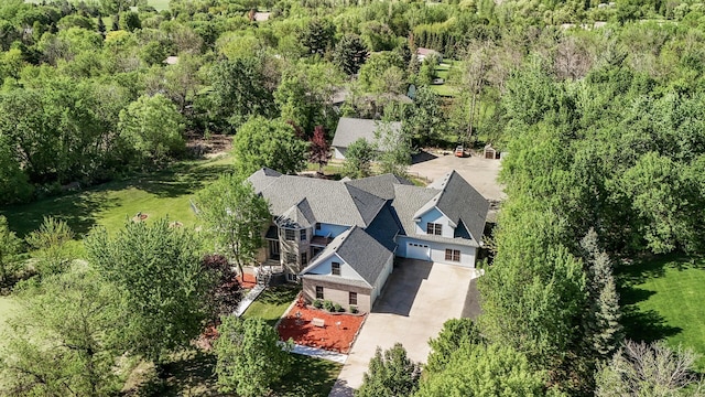 view of subject property featuring a forest
