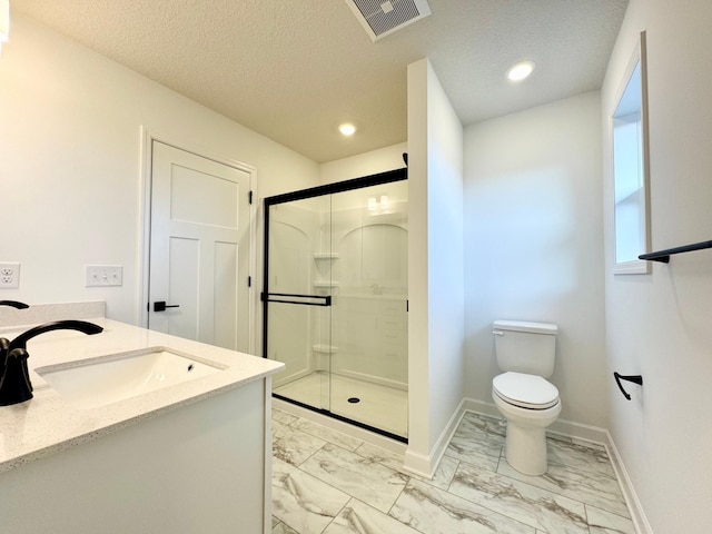 full bathroom featuring marble look tiles, a stall shower, baseboards, toilet, and a textured ceiling
